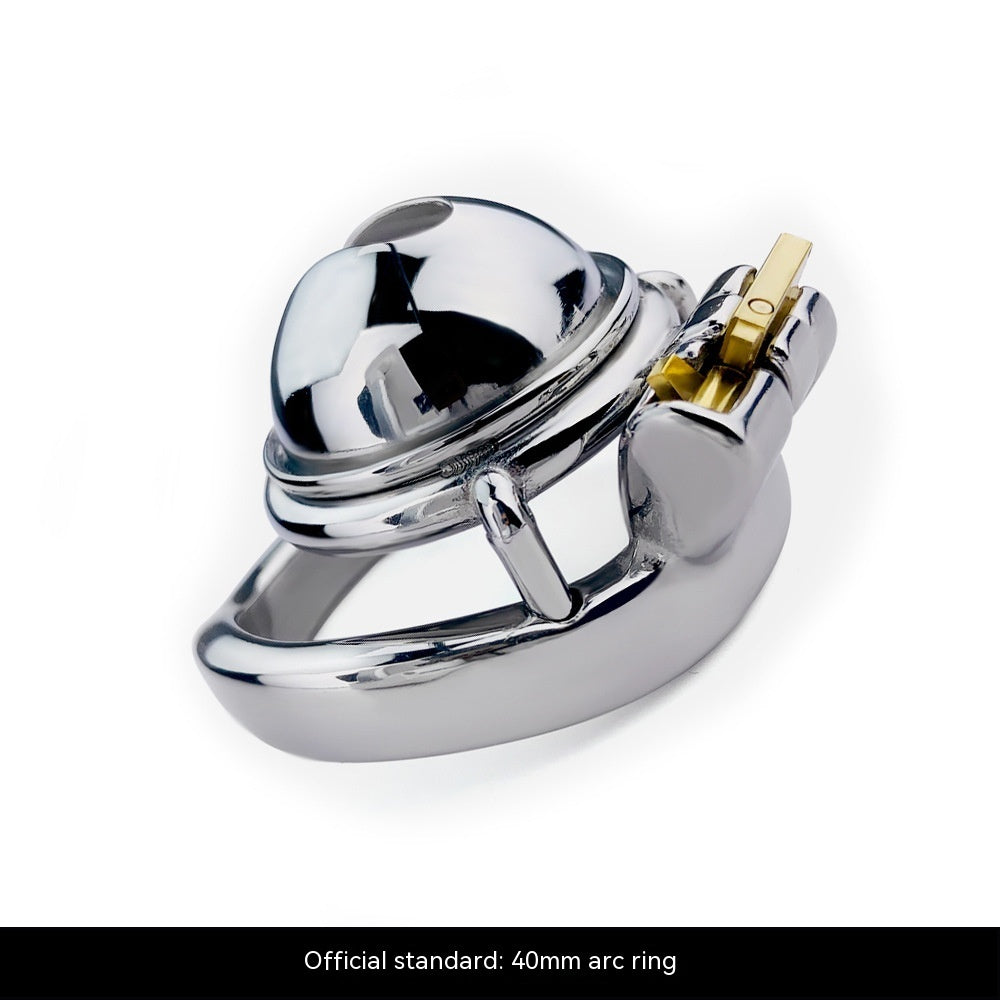 Compact Miniature Chastity Lock Stainless Steel Metal with a shiny dome and secure gold lock mechanism.